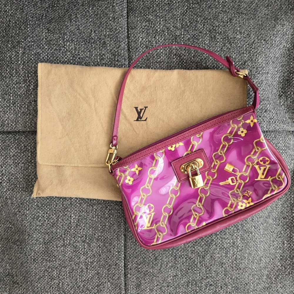 Limited edition fuschia Monogram charms pochette
